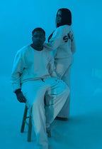 Man and woman wearing the Smile Sweat set in the colors cream and brown.